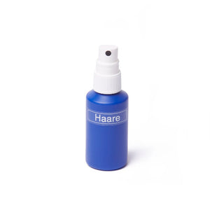 Kleine blaue Flasche Haare